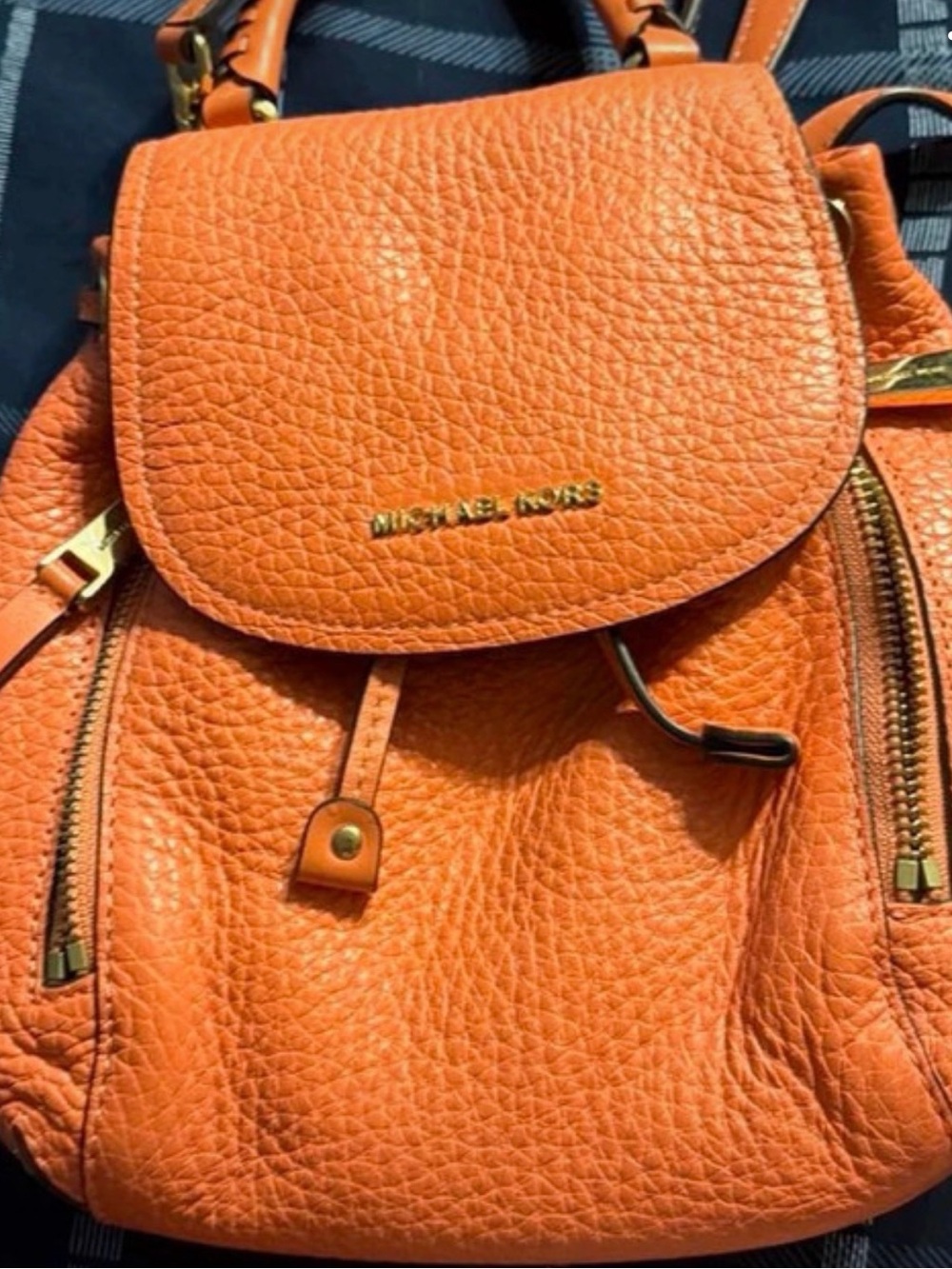 Michael Kors Orange Pebbled Leather Flap Backpack with Gold Hardware